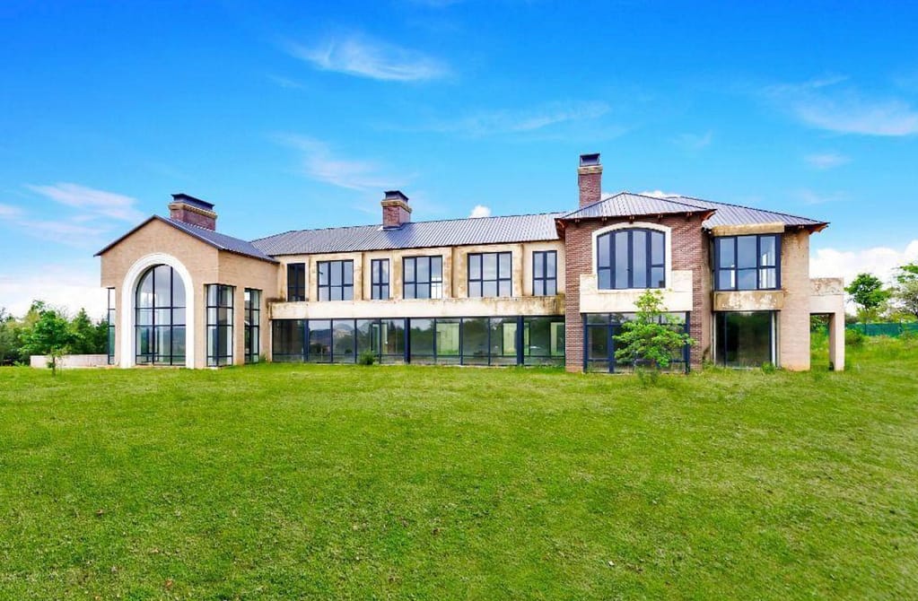 Unfinished Mega Home With A 40-Car Subterranean Garage