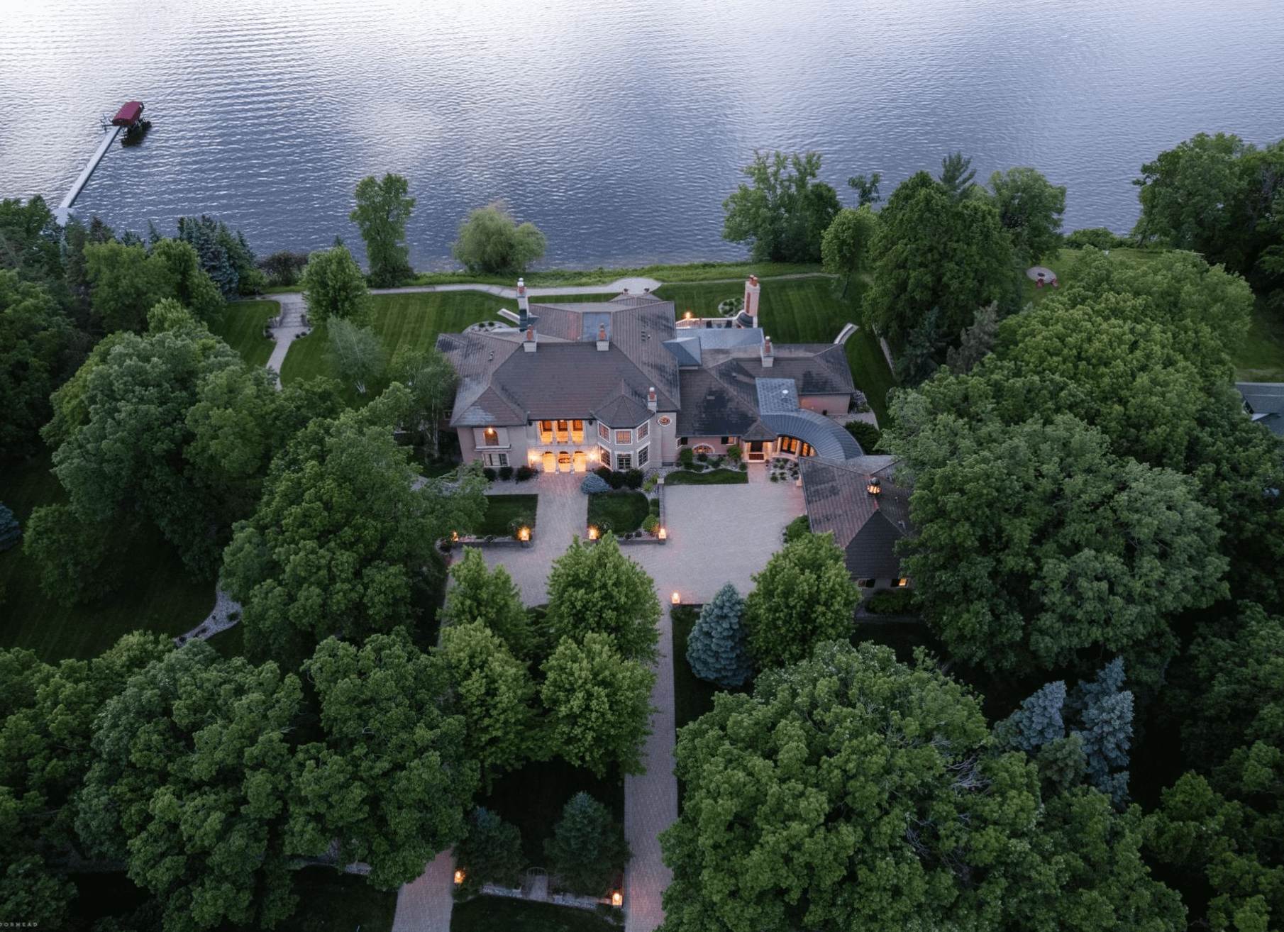 Lakefront Estate In Minnesota With 20-Car Showroom Garage